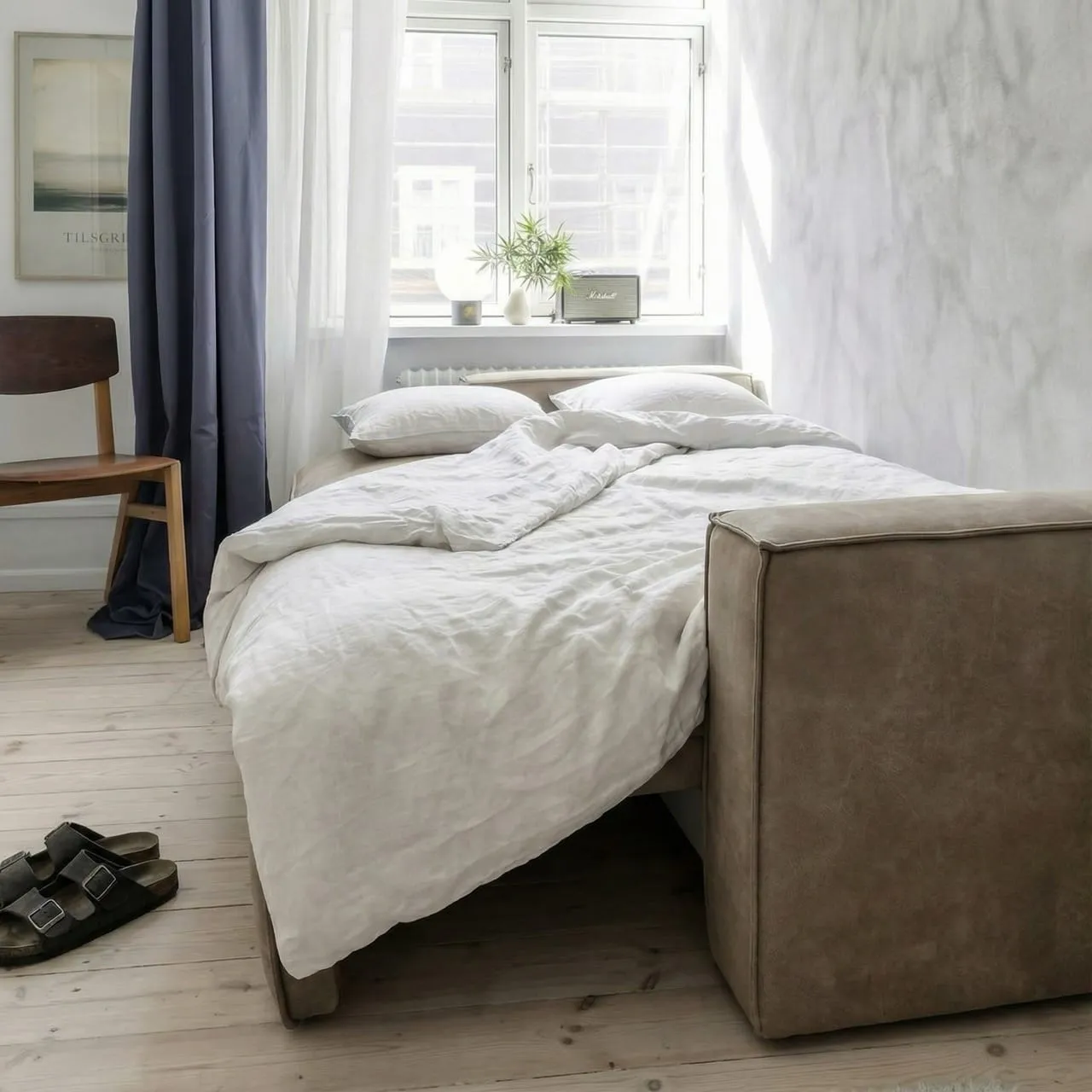 Detalje af sovesofa med skjult mekanisme og elegant design